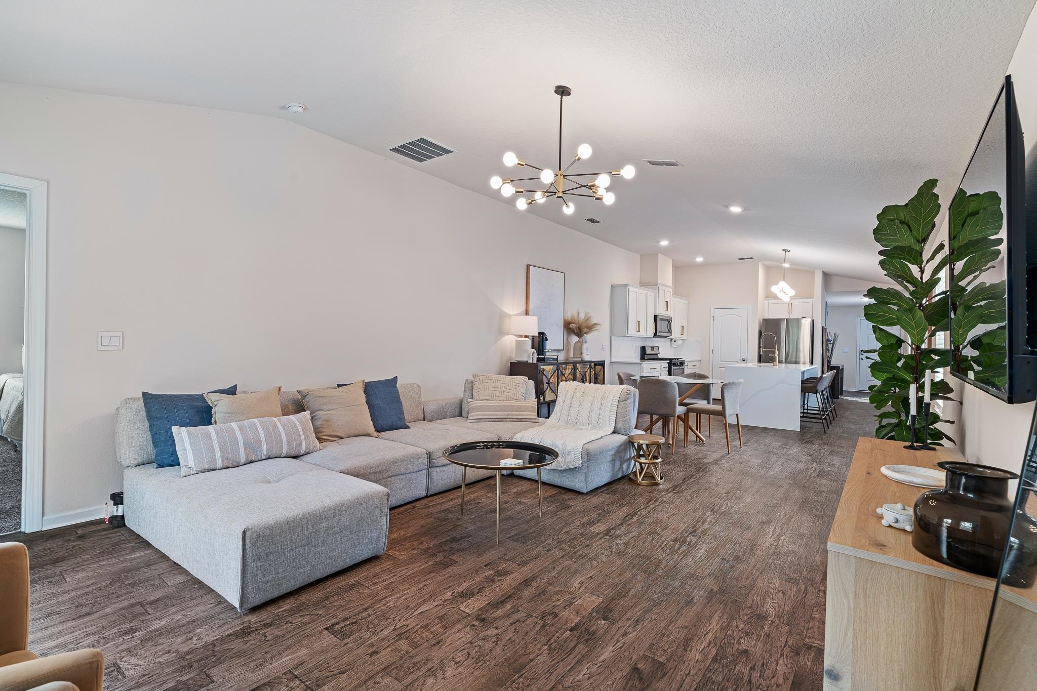 147 Logrono Court St. Augustine, FL 32084 - Photo 17 of 50 a living room with furniture kitchen view and a chandelier