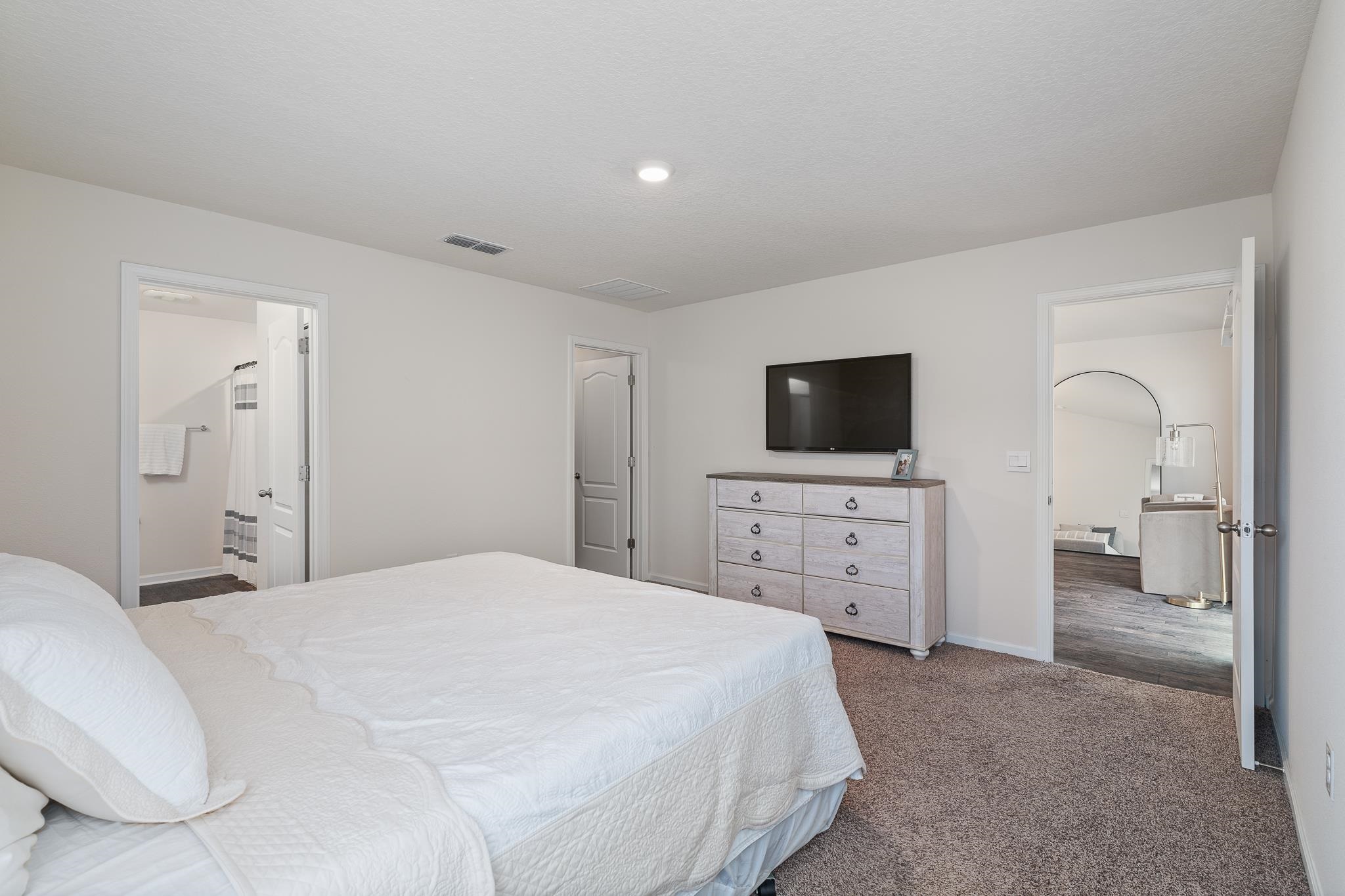 147 Logrono Court St. Augustine, FL 32084 - Photo 20 of 50 a bedroom with a bed and a flat screen tv