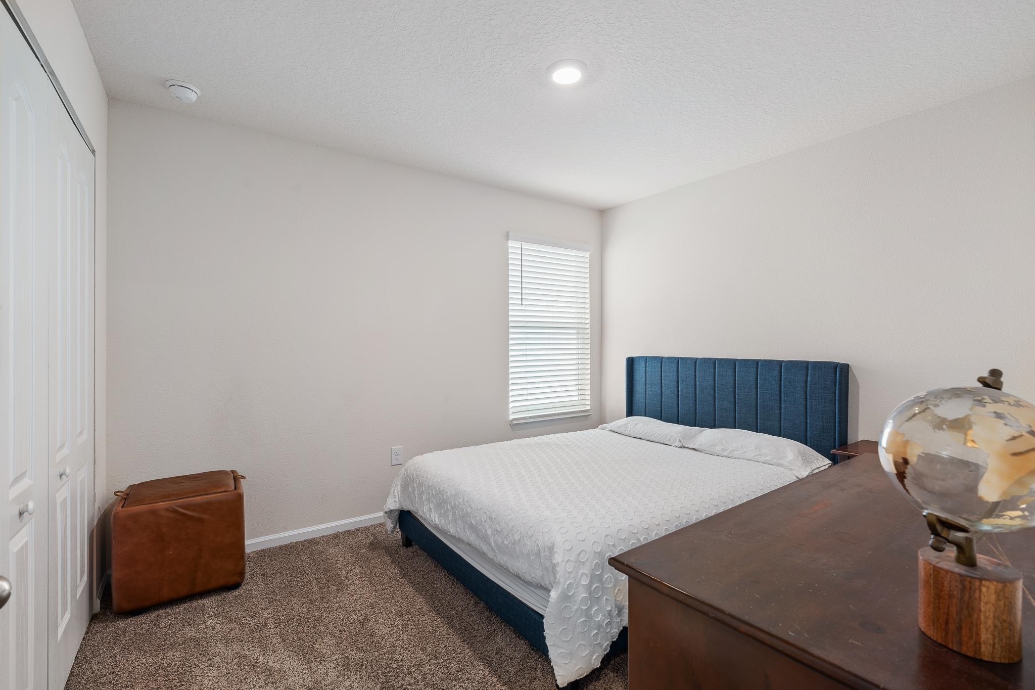 147 Logrono Court St. Augustine, FL 32084 - Photo 23 of 50 a bedroom with a bed and a window