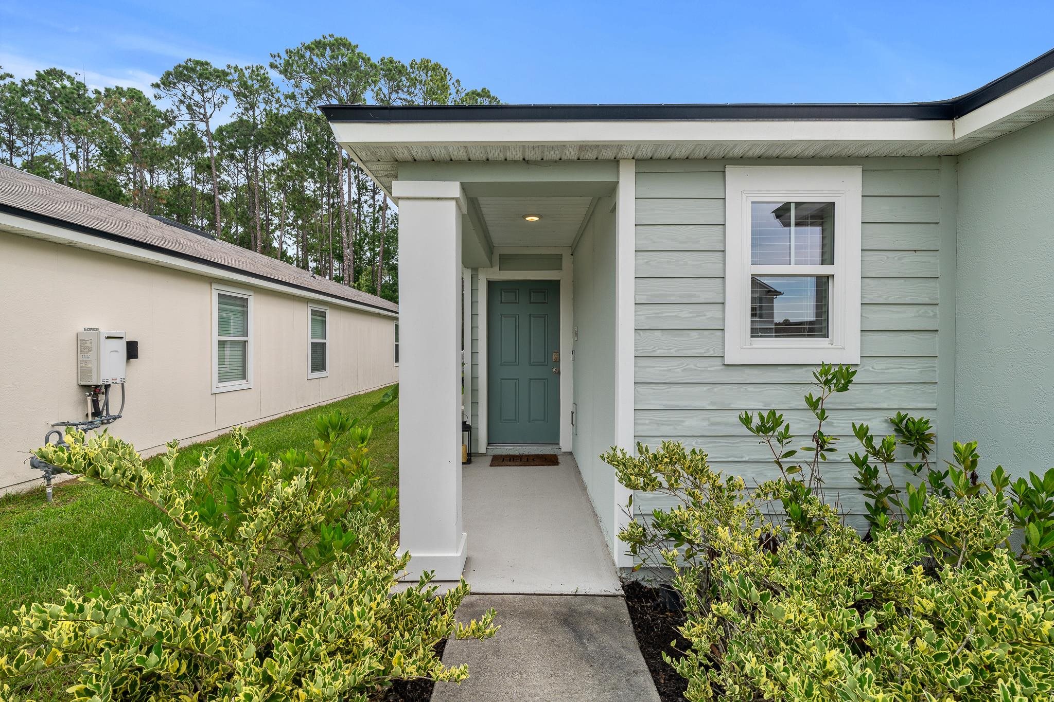 147 Logrono Court St. Augustine, FL 32084 - Photo 7 of 50 front view of a house with a yard