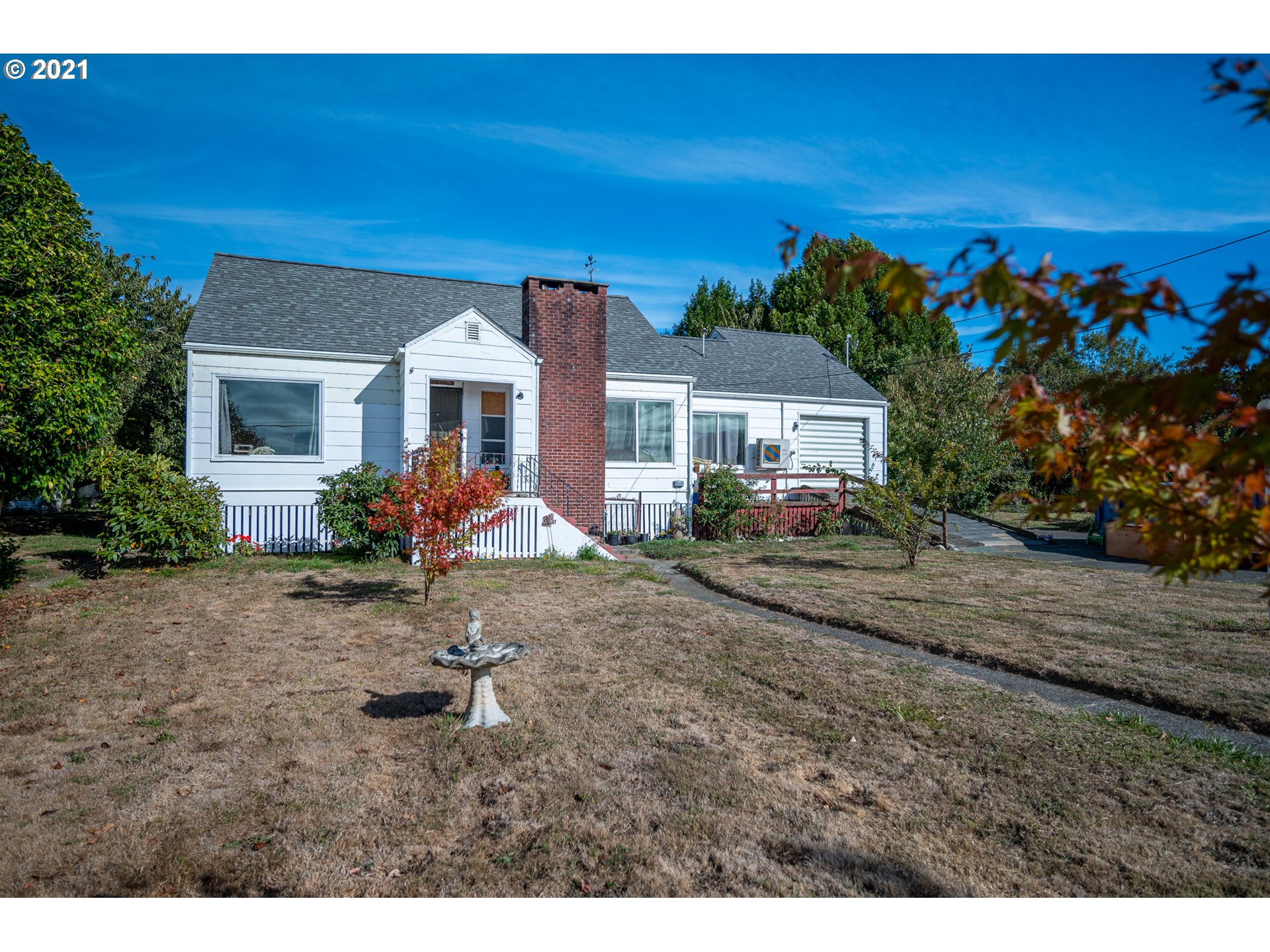 55561 Fishtrap Road Coquille, OR 97423 - Photo 1 of 31 a view of a house with a backyard