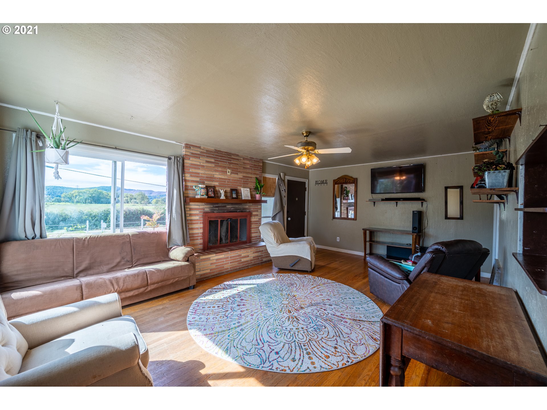 55561 Fishtrap Road Coquille, OR 97423 - Photo 22 of 31 a living room with furniture and a fireplace