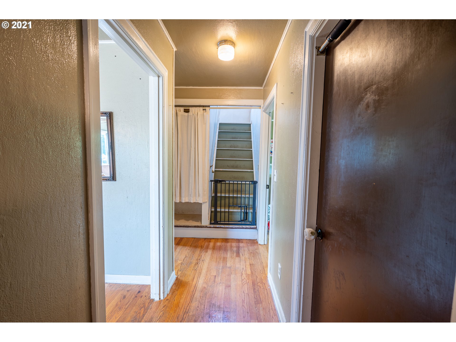 55561 Fishtrap Road Coquille, OR 97423 - Photo 26 of 31 a view of a hallway with wooden floor