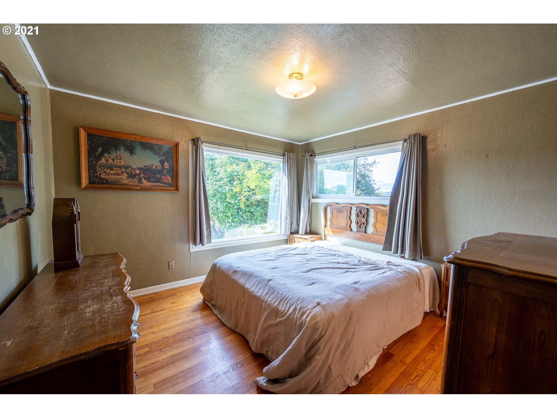 55561 Fishtrap Road Coquille, OR 97423 - Photo 27 of 31 a bedroom with a bed and a window