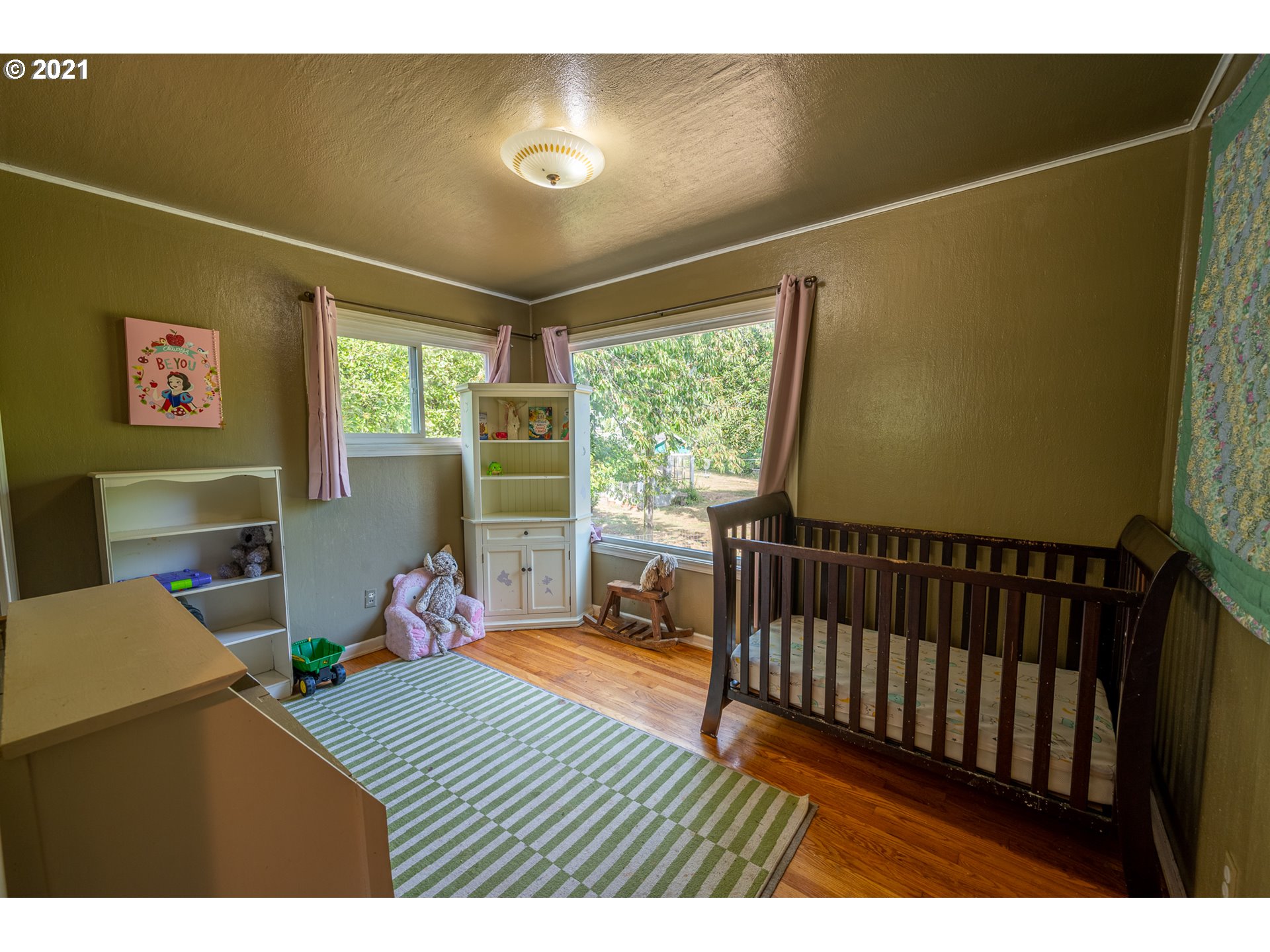 55561 Fishtrap Road Coquille, OR 97423 - Photo 29 of 31 a bedroom with furniture and a window