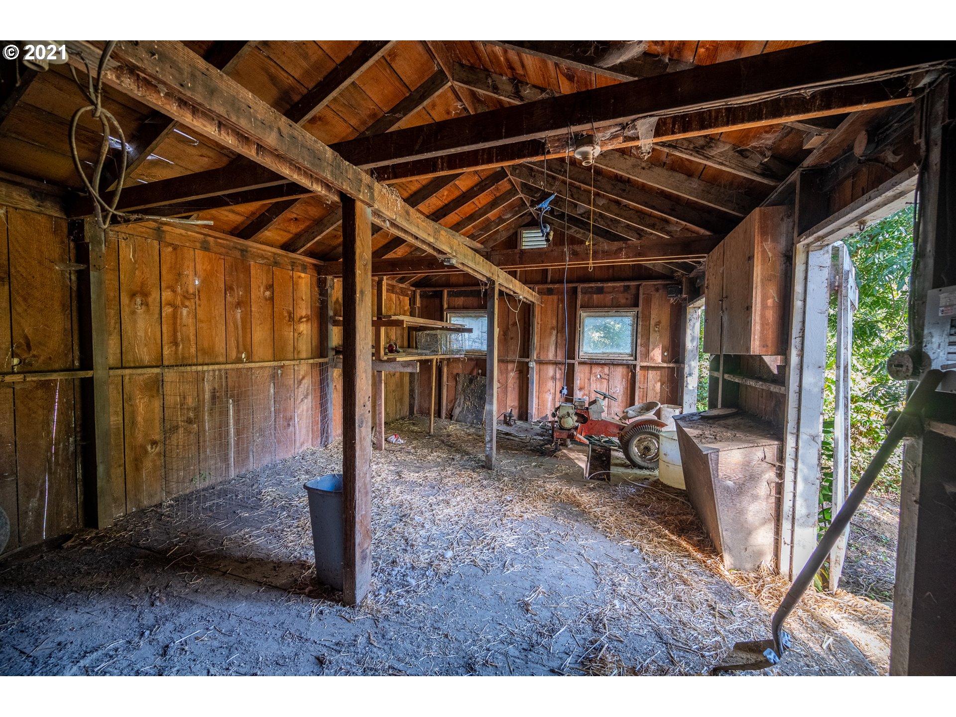 55561 Fishtrap Road Coquille, OR 97423 - Photo 30 of 31 a view of a backyard with wooden floor and roof