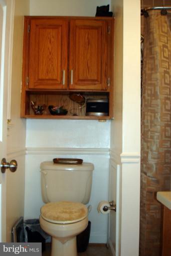 8803 Riggs Road Hyattsville, MD 20783 - Photo 1 of 24 a bathroom with a toilet and a sink