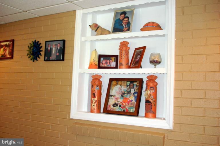 8803 Riggs Road Hyattsville, MD 20783 - Photo 21 of 24 a wall with a painting on the wall