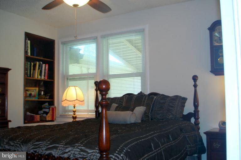 8803 Riggs Road Hyattsville, MD 20783 - Photo 10 of 24 a living room with furniture lamp and a large window