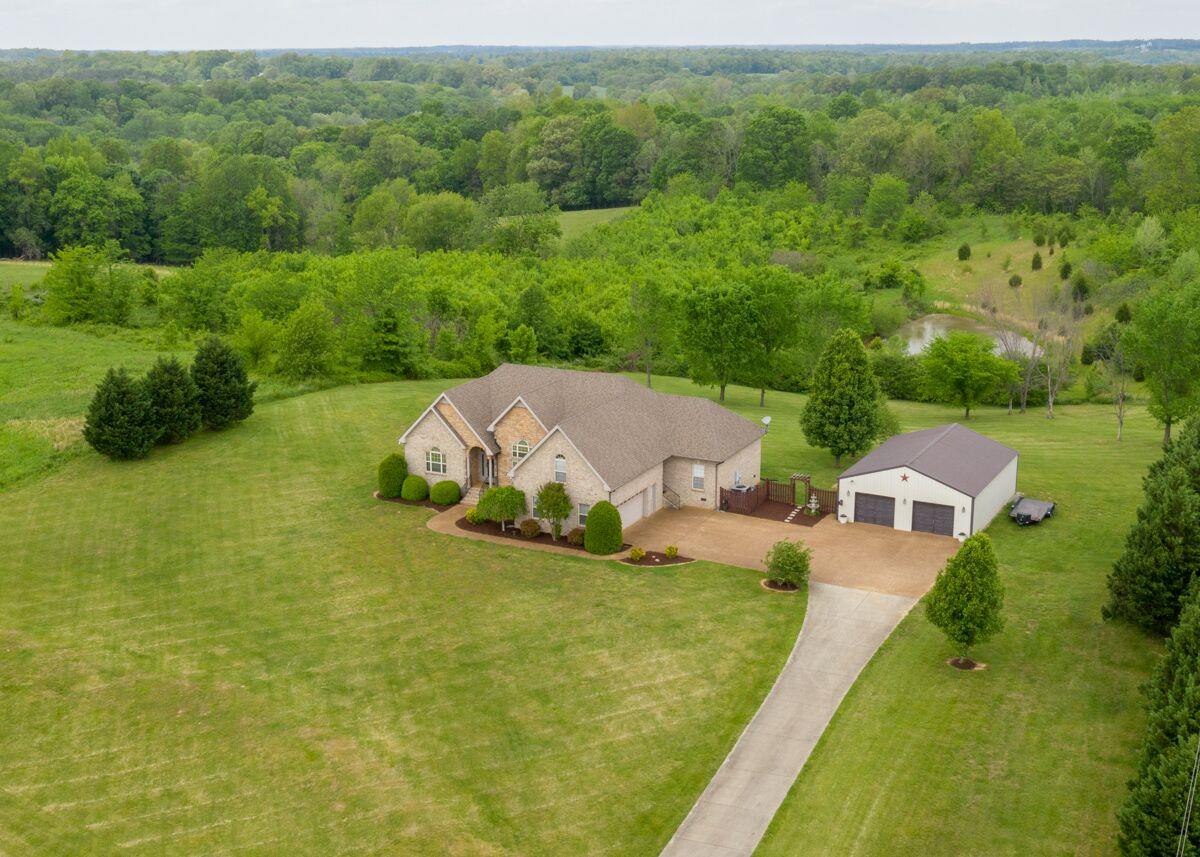 Custom Built Home on approx 5.0 Acres offering beautiful views from front and back.