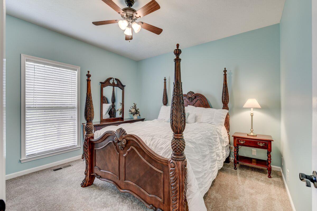 3454 Catholic Church Road Cedar Hill, TN 37032 - Photo 18 of 30 2nd Bedroom with Ceiling Fan. Love the fresh bright color of this room.