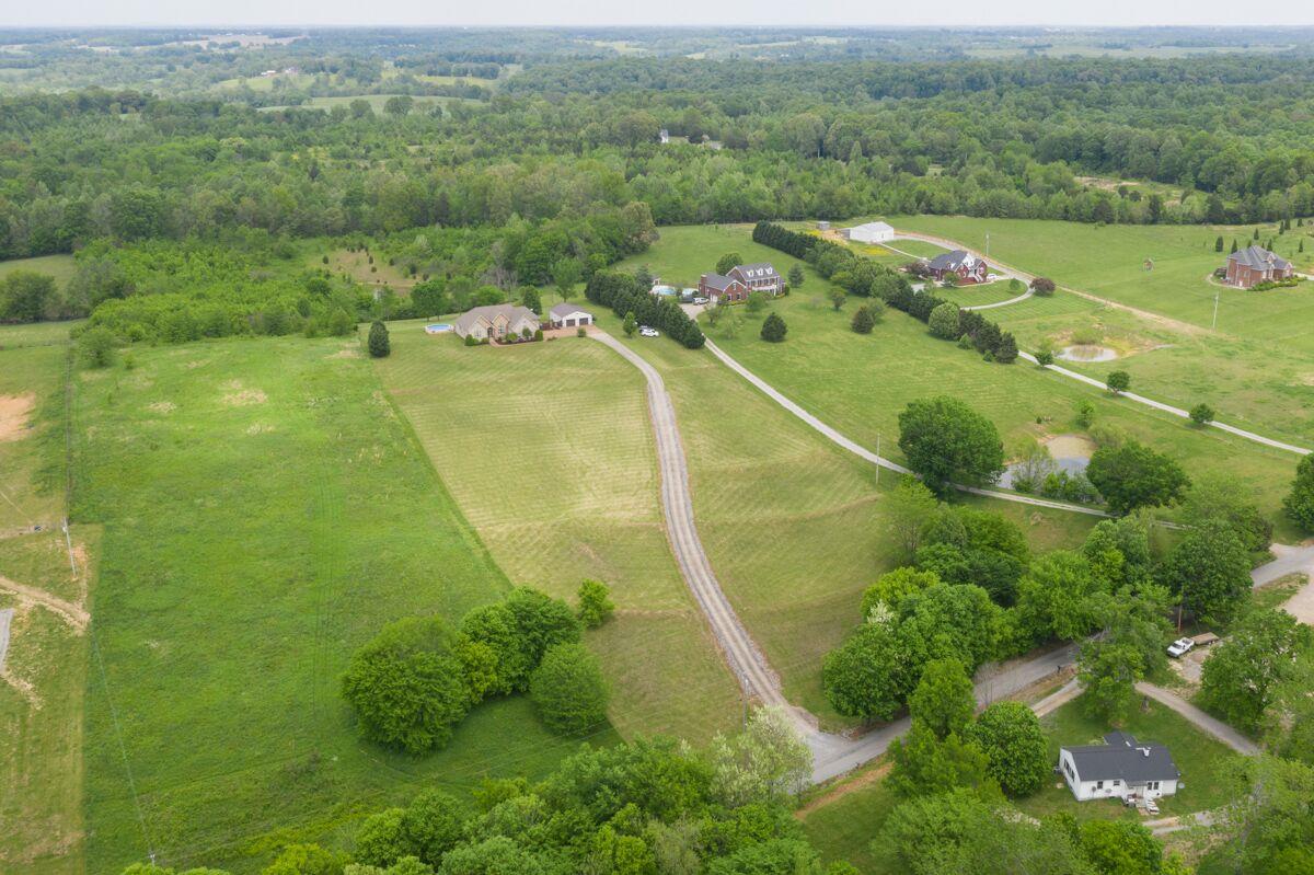 As you can see from the Aerial View this home seta off the the road and has a long concrete driveway.