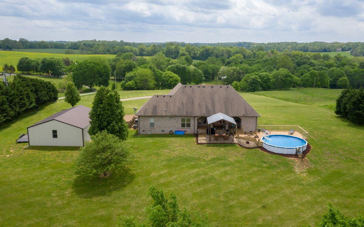 3454 Catholic Church Road Cedar Hill, TN 37032 - Photo 27 of 30 A view of the Back of the Home with the Above Ground/ In-Ground Pool.