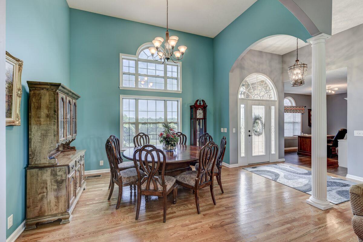 Natural light pours into Formal Dining Room from the large windows.
