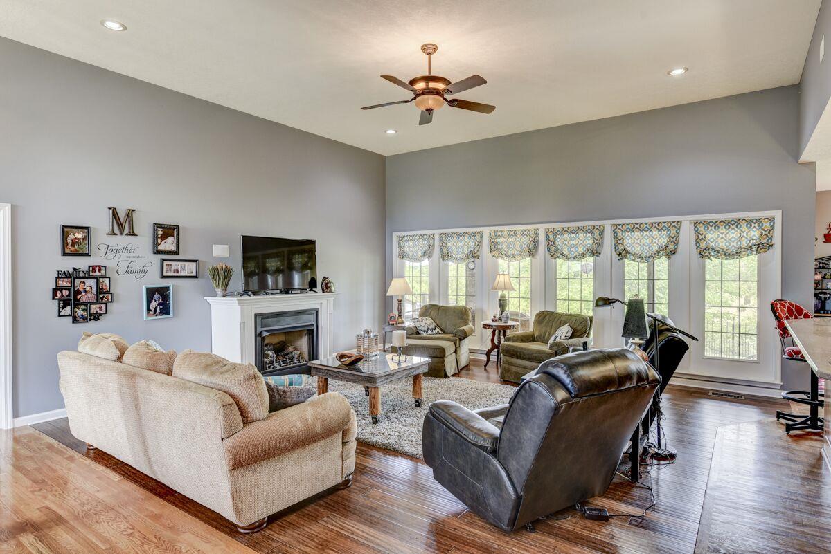 3454 Catholic Church Road Cedar Hill, TN 37032 - Photo 9 of 30 Large Living Room offers Ceiling Fan, Gas log Fireplace and plenty of windows for that natural lighting.