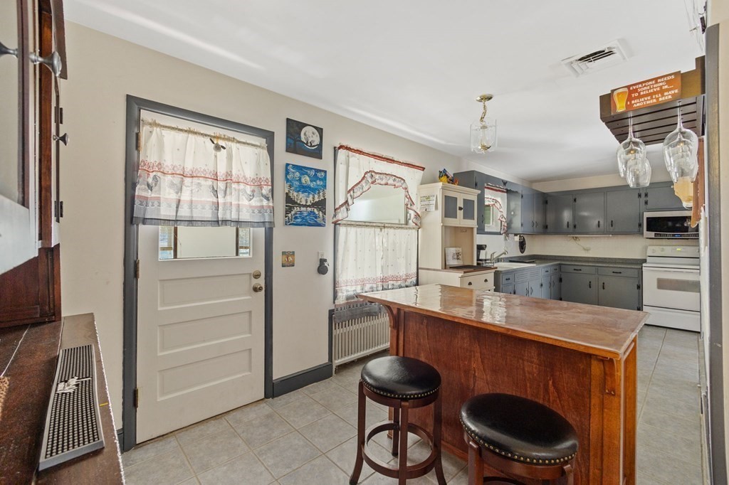 1247 Bay Road Sharon, MA 02067 - Photo 16 of 41 a kitchen with a sink cabinets and window
