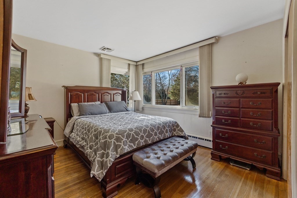 1247 Bay Road Sharon, MA 02067 - Photo 18 of 41 a bedroom with a bed and a dresser