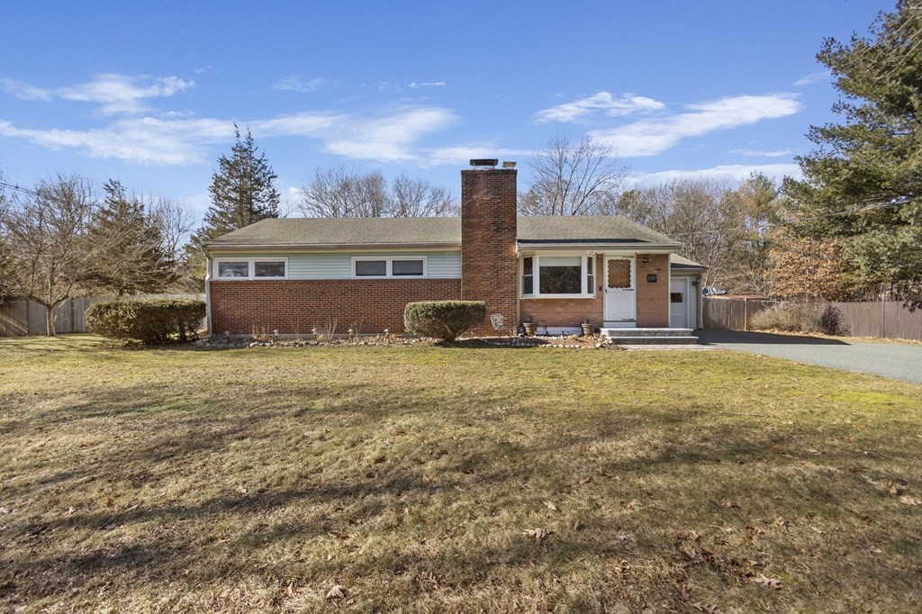 1247 Bay Road Sharon, MA 02067 - Photo 2 of 41 a front view of a house with a yard