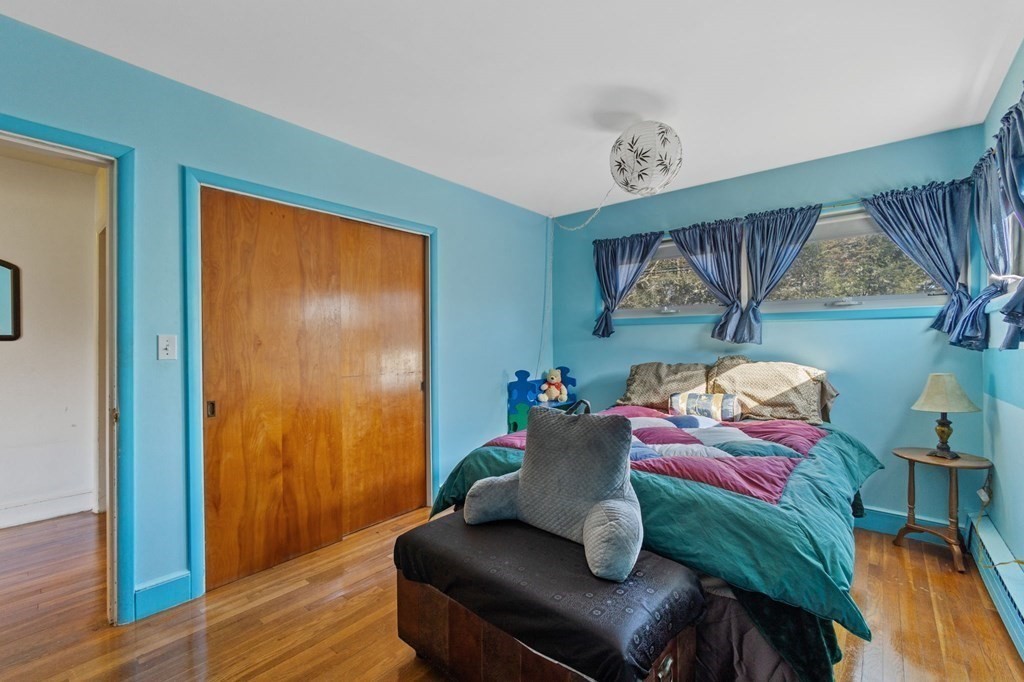 1247 Bay Road Sharon, MA 02067 - Photo 23 of 41 a living room with furniture and a wooden floor