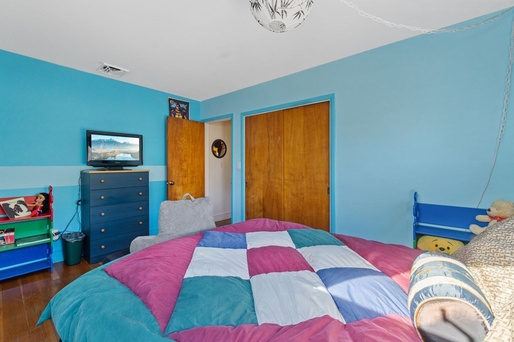 1247 Bay Road Sharon, MA 02067 - Photo 24 of 41 a bedroom with a bed and wooden floor