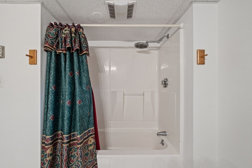 1247 Bay Road Sharon, MA 02067 - Photo 25 of 41 a bathroom with a bathtub and a shower