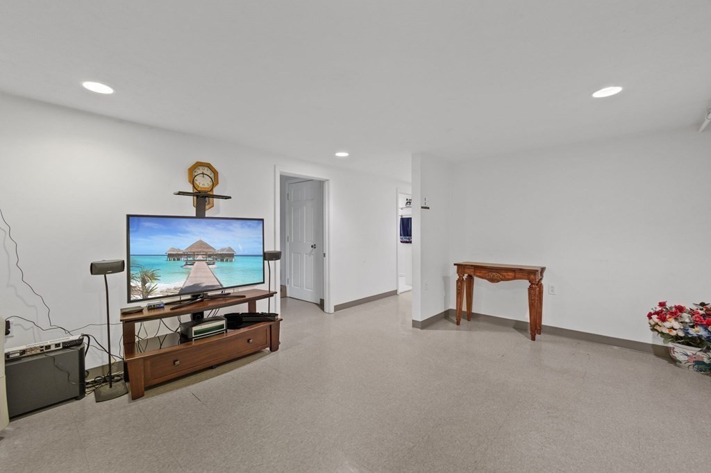1247 Bay Road Sharon, MA 02067 - Photo 29 of 41 a living room with furniture and a flat screen tv