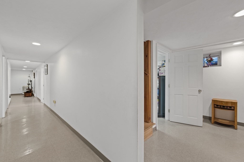 1247 Bay Road Sharon, MA 02067 - Photo 30 of 41 a view of a hallway with closet and cabinet
