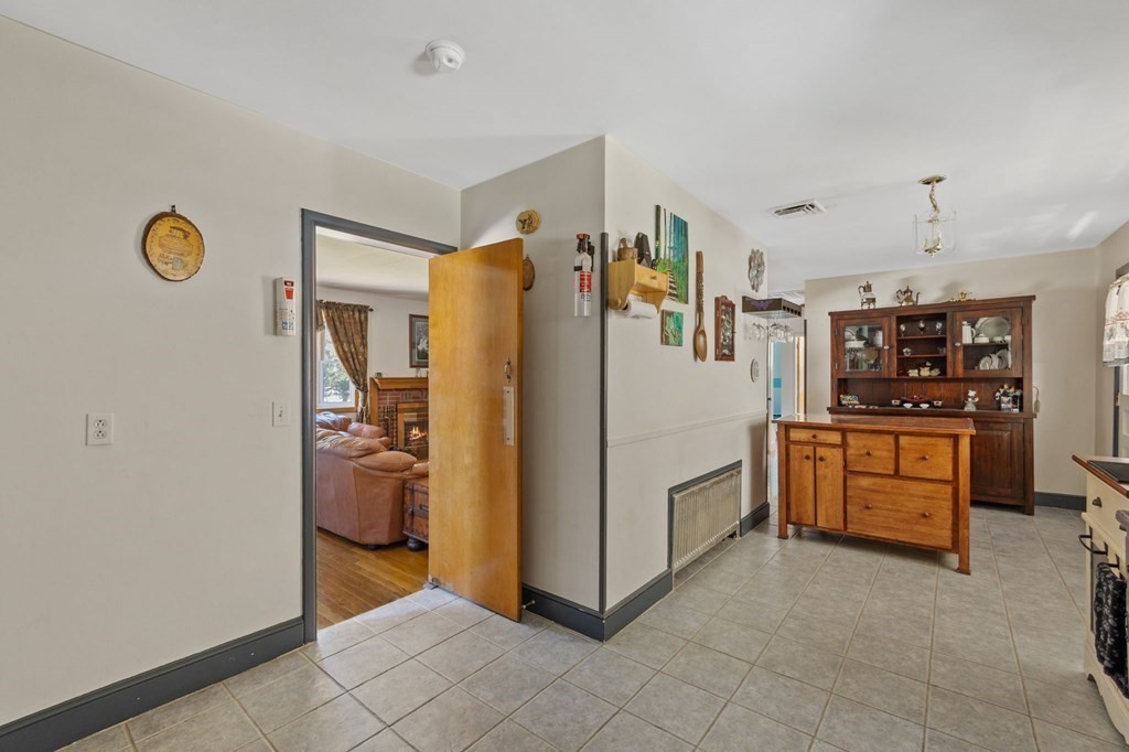 1247 Bay Road Sharon, MA 02067 - Photo 32 of 41 a kitchen with stainless steel appliances a refrigerator and cabinets