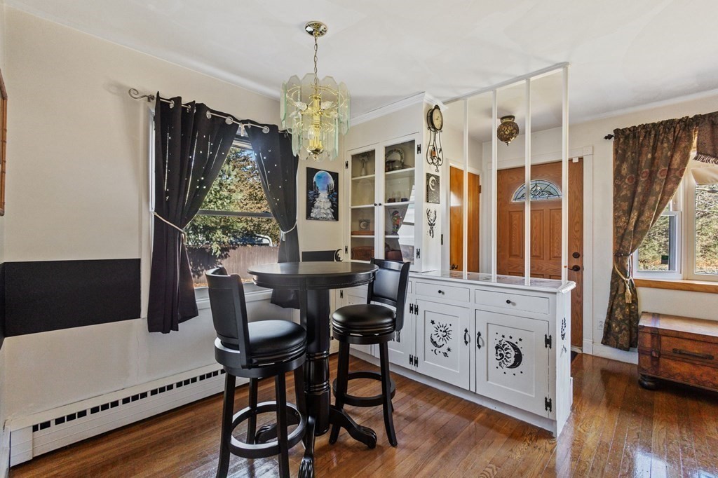 1247 Bay Road Sharon, MA 02067 - Photo 10 of 41 a view of a dining room with furniture and wooden floor