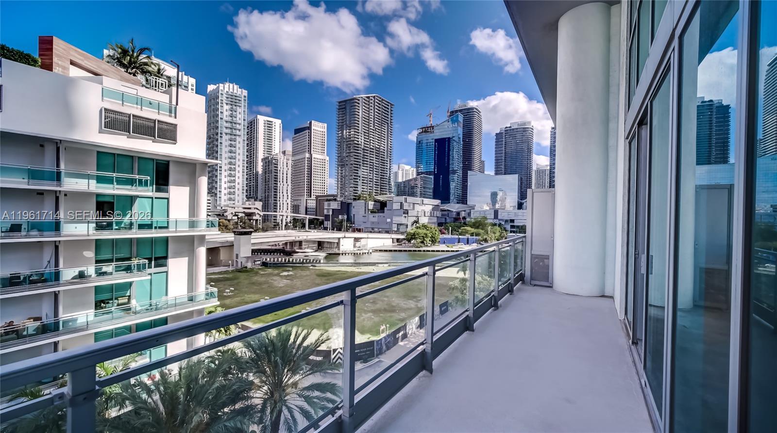 90 Southwest 3rd Street, Unit TH706 Miami, FL 33130 - Photo 15 of 37 a kitchen with stainless steel appliances granite countertop a lot of cabinets