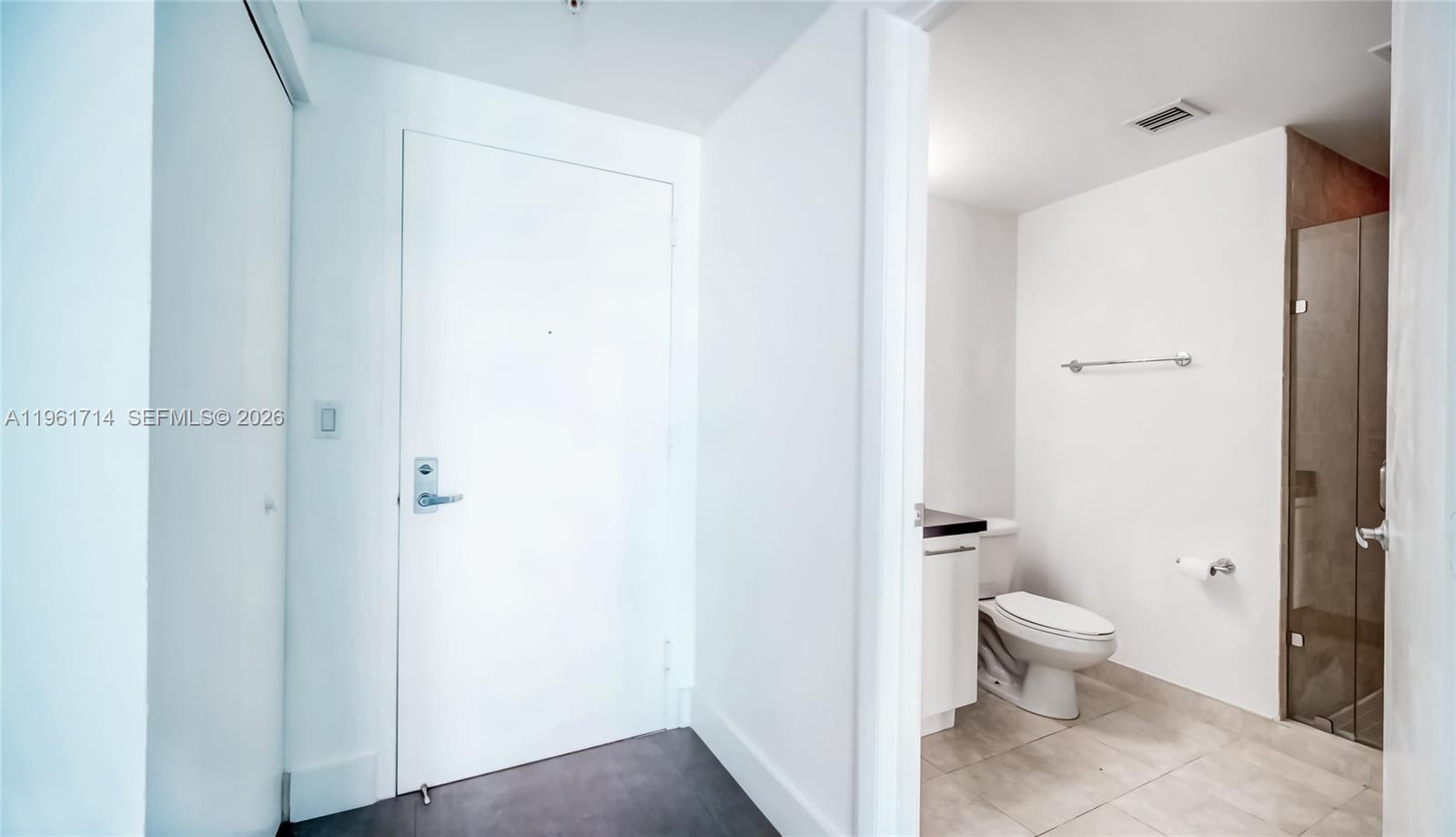 90 Southwest 3rd Street, Unit TH706 Miami, FL 33130 - Photo 5 of 37 a bathroom with a toilet and a shower