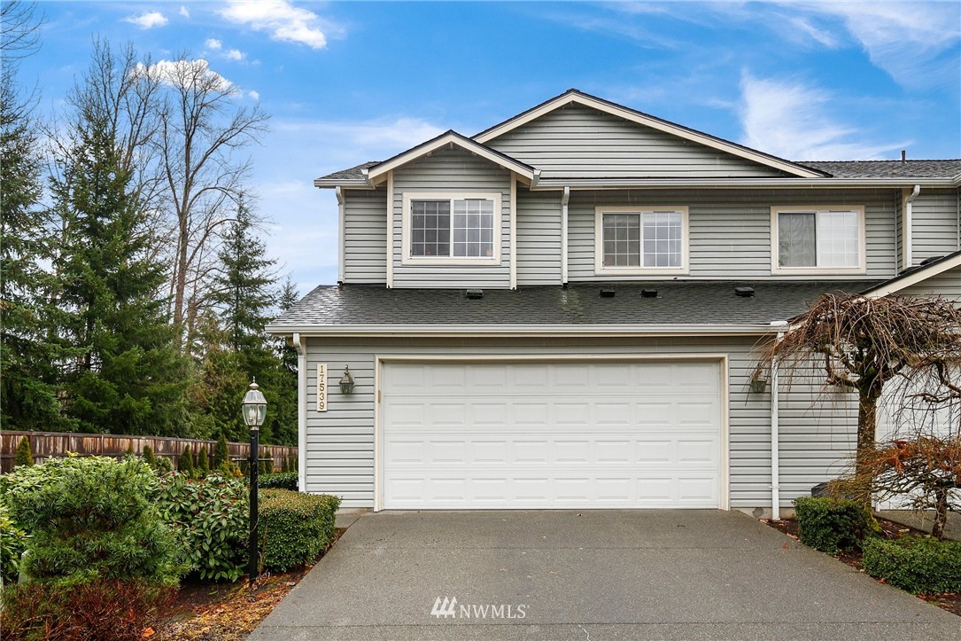 a front view of a house with a garage
