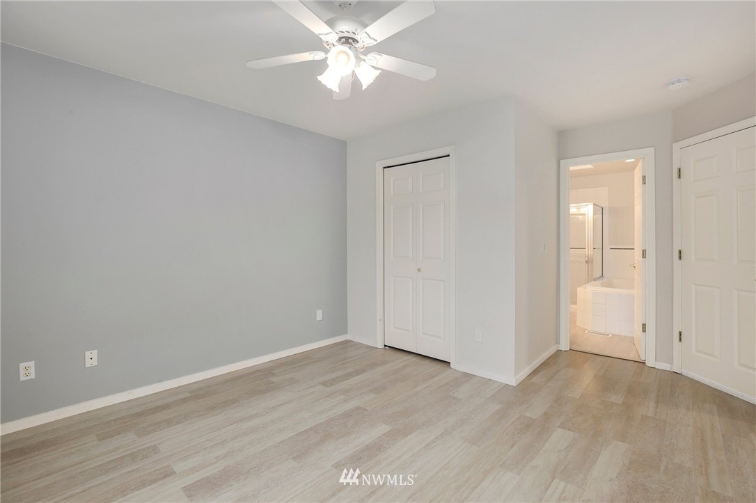 17539 110 Lane Southeast, Unit 20 Renton, WA 98055 - Photo 13 of 25 wooden floor in an empty room with a window