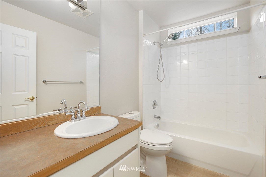 17539 110 Lane Southeast, Unit 20 Renton, WA 98055 - Photo 17 of 25 a bathroom with a sink toilet and shower