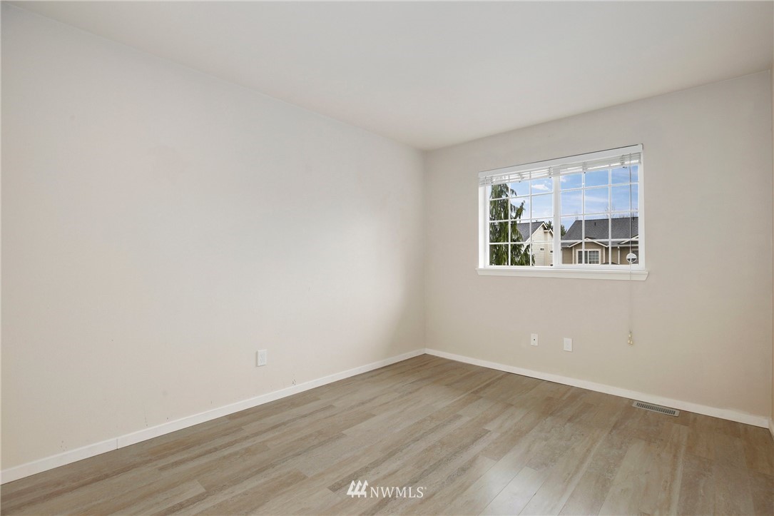 17539 110 Lane Southeast, Unit 20 Renton, WA 98055 - Photo 18 of 25 wooden floor in an empty room with a window