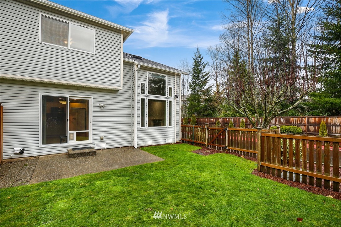 17539 110 Lane Southeast, Unit 20 Renton, WA 98055 - Photo 21 of 25 a view of a house with a yard and deck