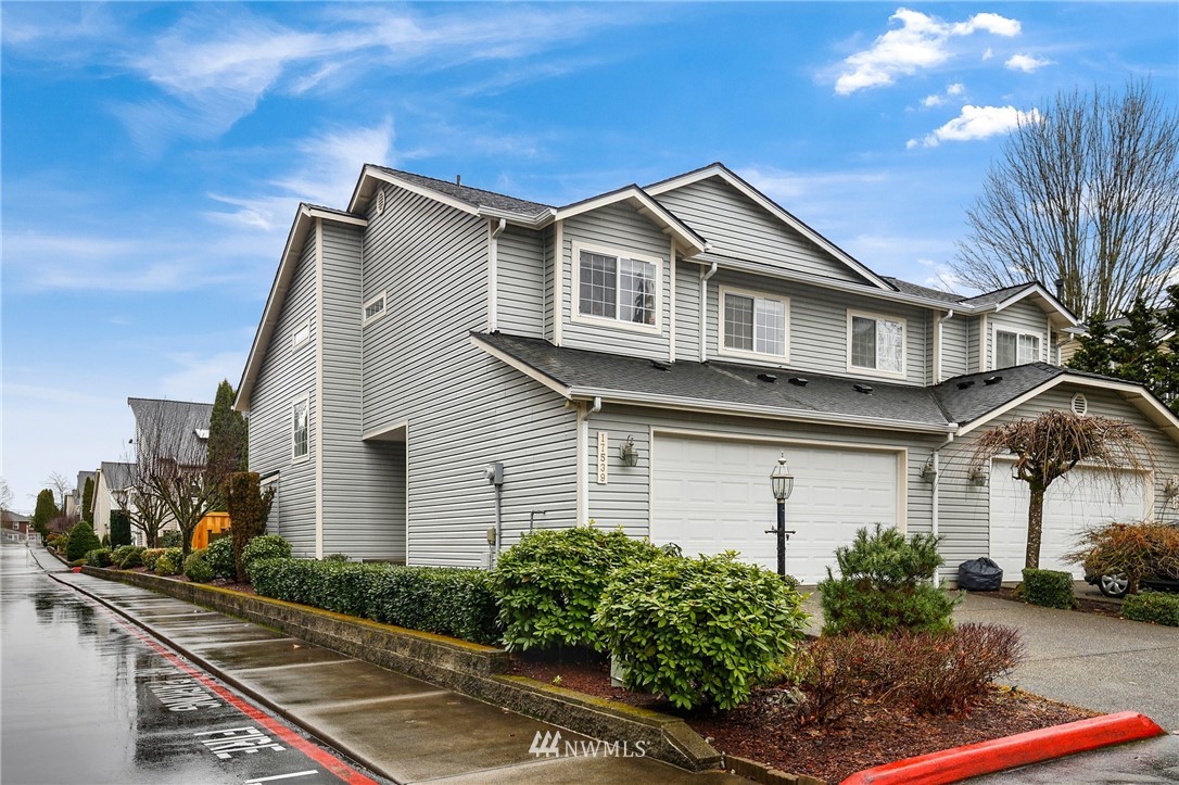 17539 110 Lane Southeast, Unit 20 Renton, WA 98055 - Photo 24 of 25 a front view of a house with garden