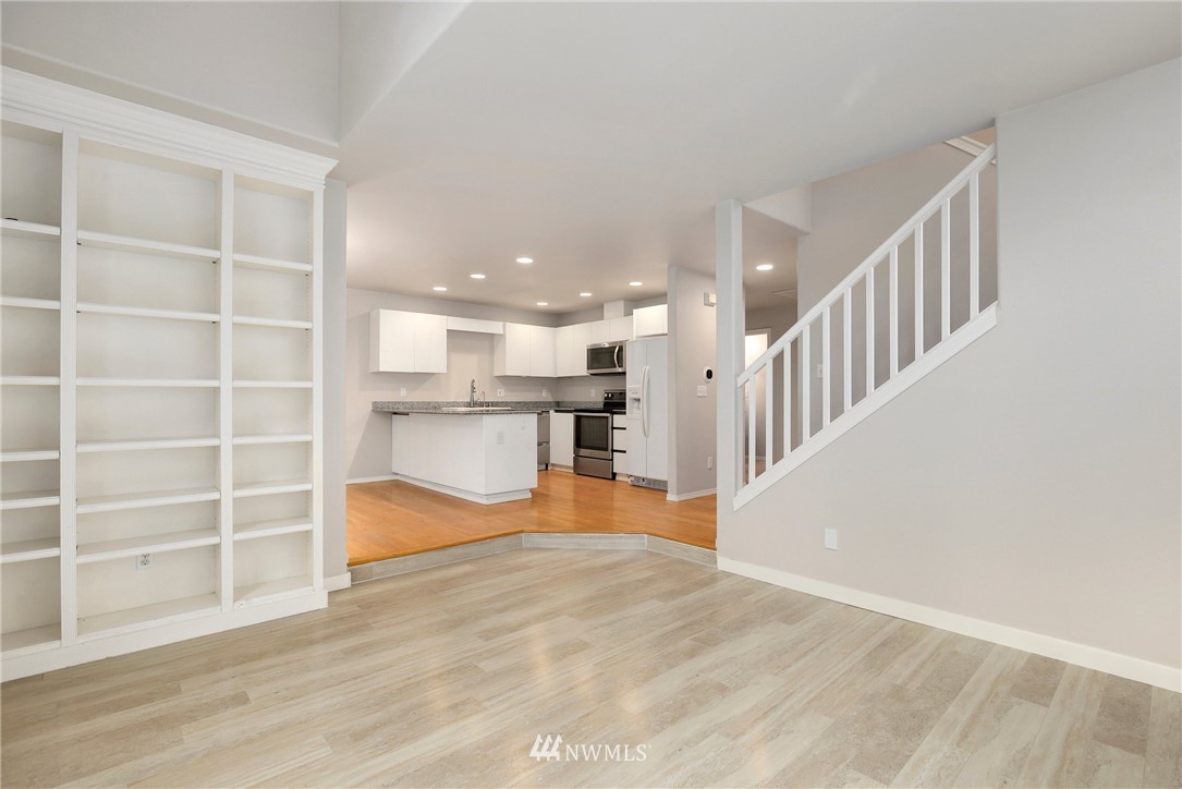 17539 110 Lane Southeast, Unit 20 Renton, WA 98055 - Photo 5 of 25 a view of a big room with wooden floor and windows