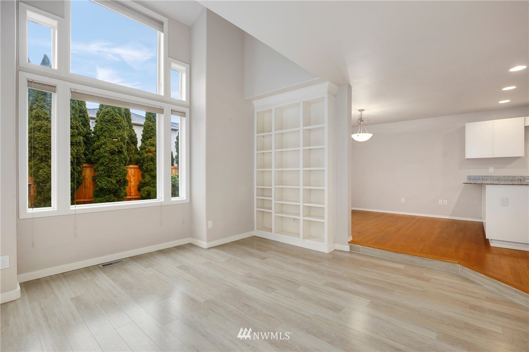 17539 110 Lane Southeast, Unit 20 Renton, WA 98055 - Photo 7 of 25 a view of empty room with wooden floor and fan