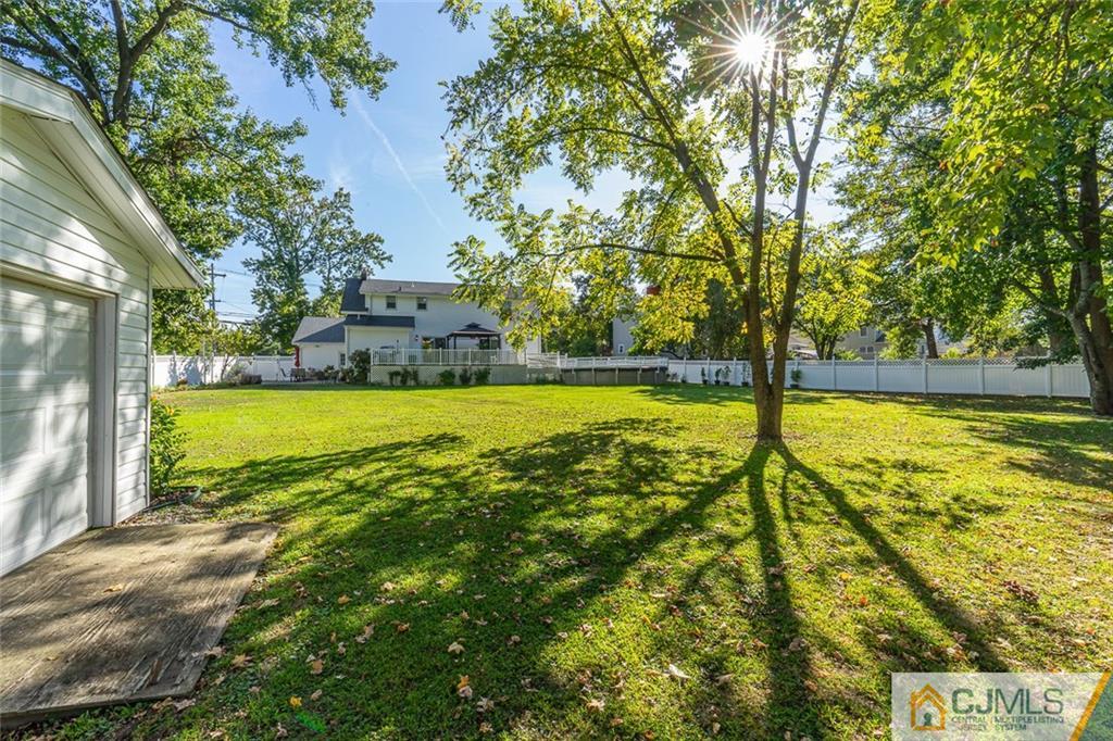 101 Aberdeen Road Aberdeen, NJ 07747 - Photo 6 of 21 a view of a swimming pool with an outdoor space and seating area