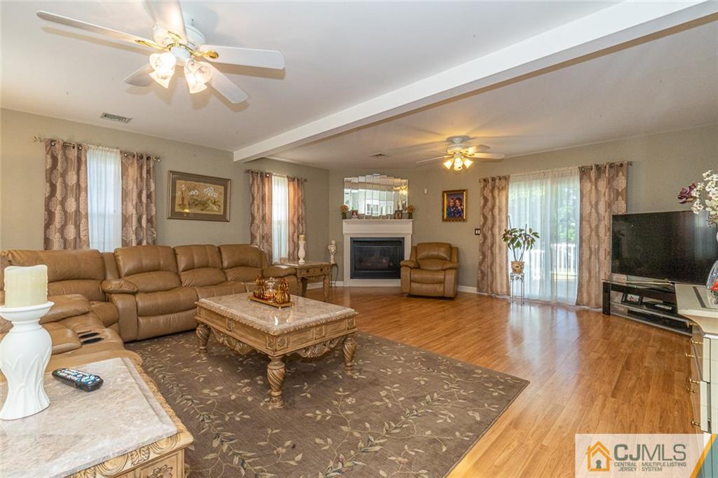101 Aberdeen Road Aberdeen, NJ 07747 - Photo 7 of 21 a living room with furniture and a flat screen tv