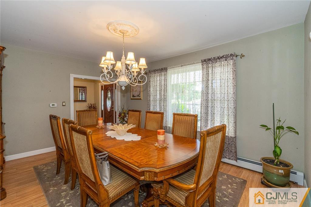 101 Aberdeen Road Aberdeen, NJ 07747 - Photo 8 of 21 a view of a dining room with furniture and chandelier
