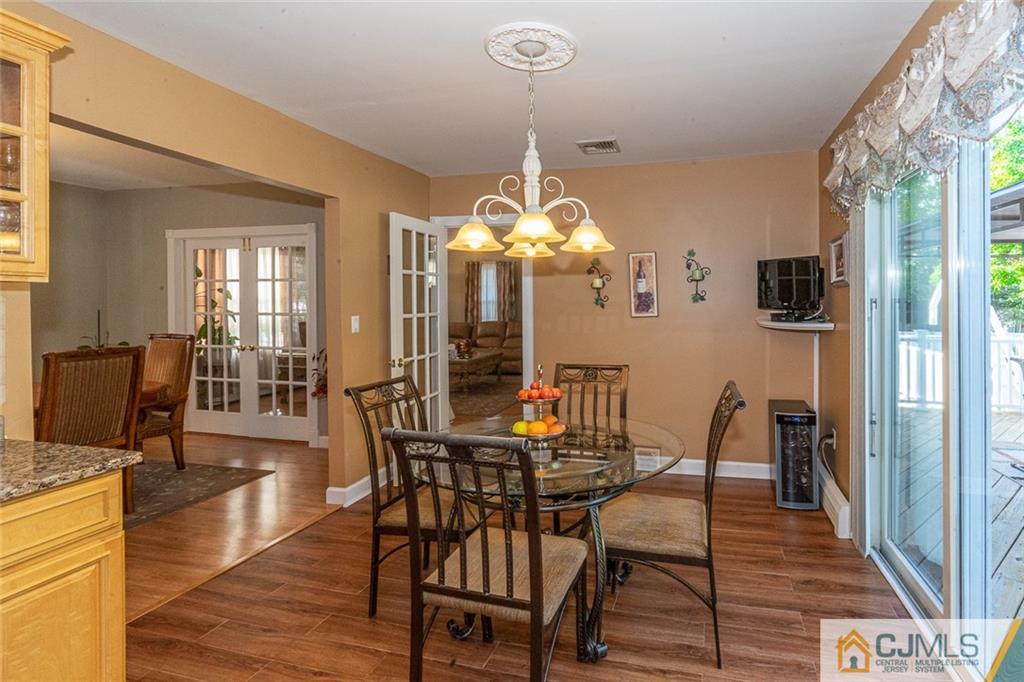 101 Aberdeen Road Aberdeen, NJ 07747 - Photo 10 of 21 a view of a dining room with furniture and wooden floor
