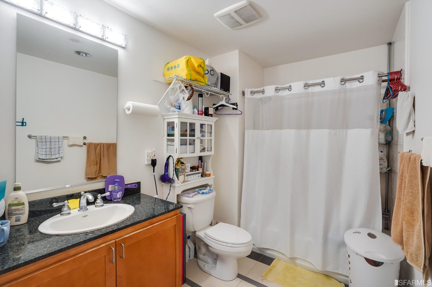 888 7th Street, Unit 120 San Francisco, CA 94107 - Photo 16 of 20 a bathroom with a sink toilet and shower