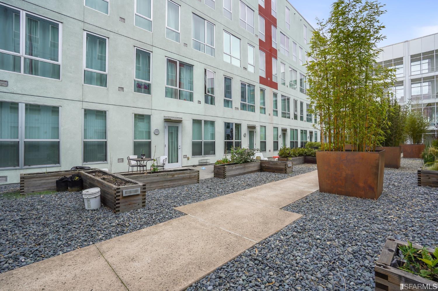 888 7th Street, Unit 120 San Francisco, CA 94107 - Photo 20 of 20 a view of a patio with couches and potted plants