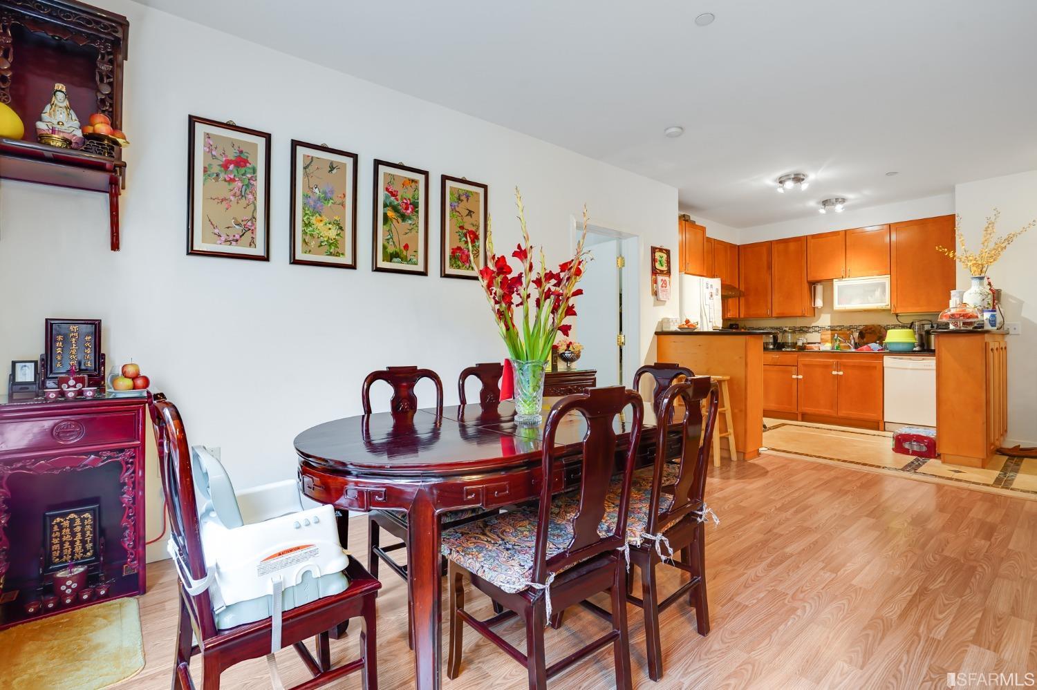 888 7th Street, Unit 120 San Francisco, CA 94107 - Photo 8 of 20 a dining room with furniture and wooden floor