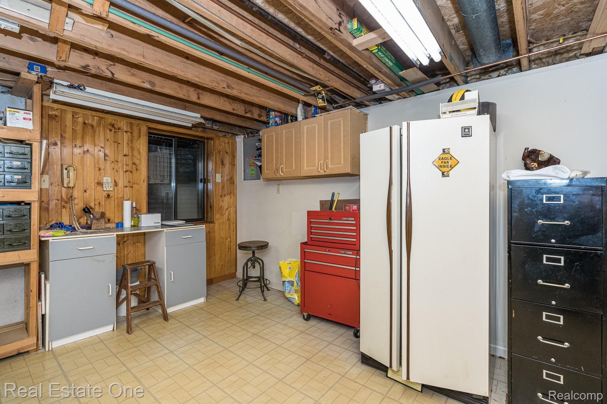 627 Tennyson Rochester, MI 48307 - Photo 20 of 25 basement workshop area.