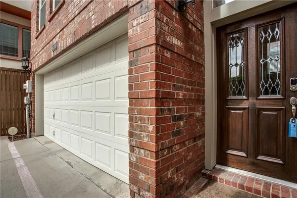 a bathroom with a shower and a plant