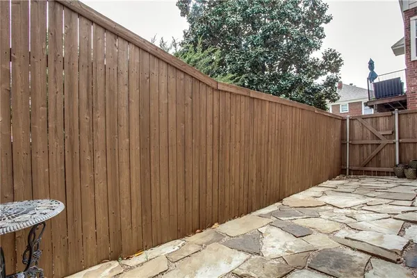 a view of a brick wall with a door