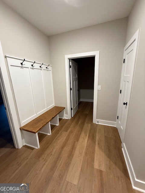 603 Silver Dollar Road Barnesville, GA 30204 - Photo 12 of 33 a view of an empty room with wooden floor and a window
